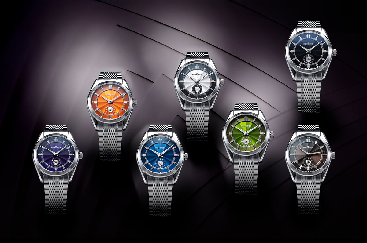 HEINRICH Radiance – flat 8 mm profile manual-wind ETA 7001 movement, blue sunburst dial on stainless steel bracelet in 7 colour dials. 